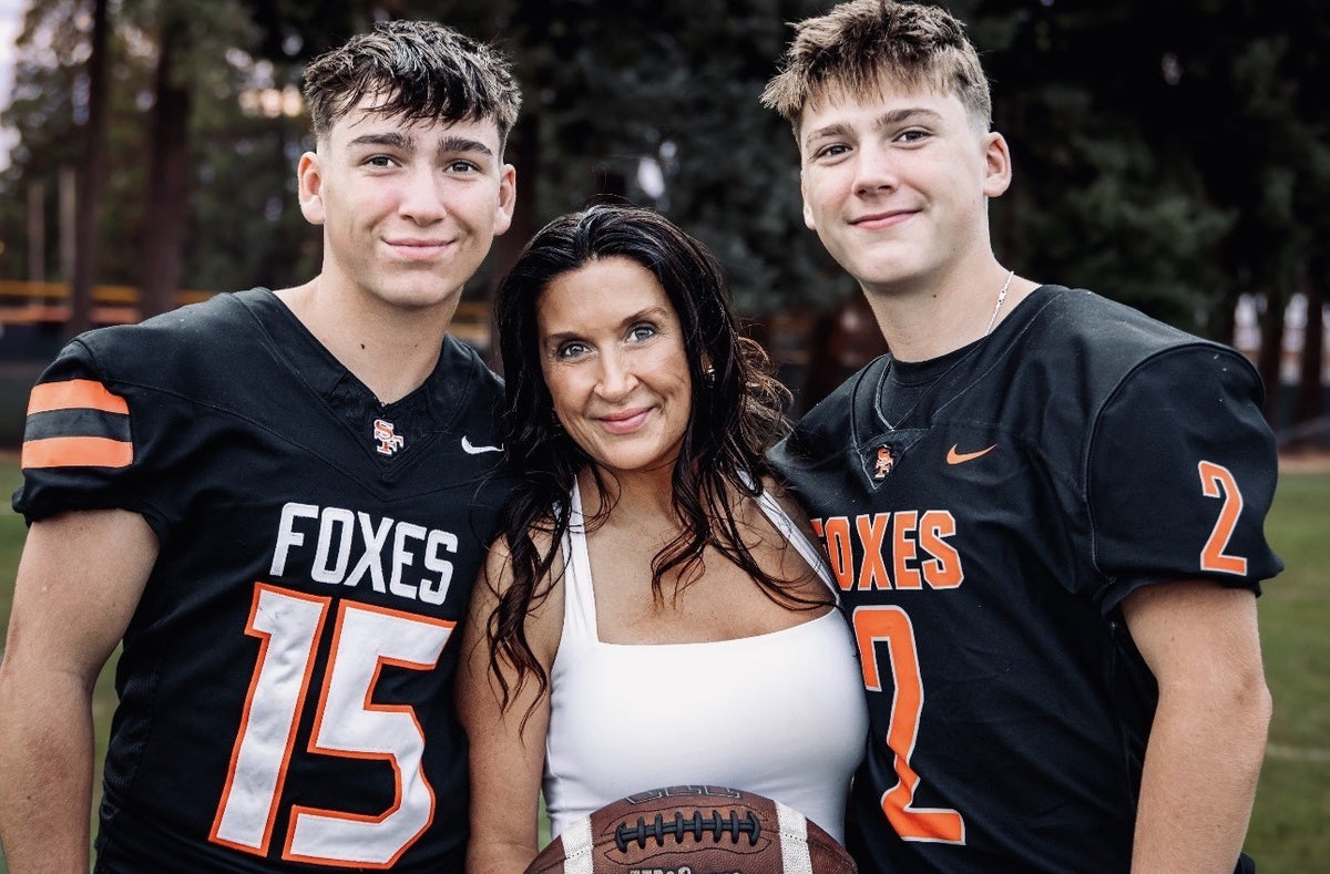 Tiffany with her sons at a football game
